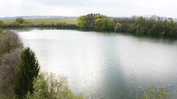 Aerial Drone Shot  a Large River in a Rural Area on a Sunny Day  Drone Flies Forward alt