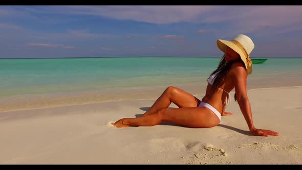 One girl relaxing on idyllic sea view beach vacation by transparent ocean with white sandy backgroun alt