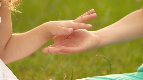 Little Girl Gives Her Hand To the Boy. Slow Motion. Close Up alt