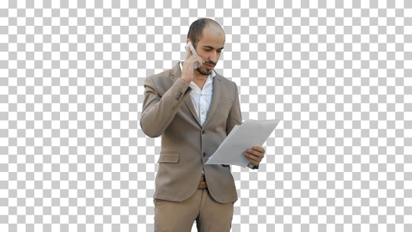 Young man in suit talking on the phone, Alpha Channel