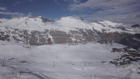 Aerial of winter hotels and winding road next Santiago, Chile alt