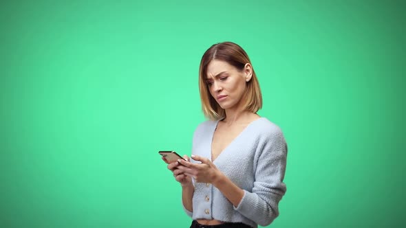 Caucasian Woman in Casual Clothes Using Mobile Cell Phone