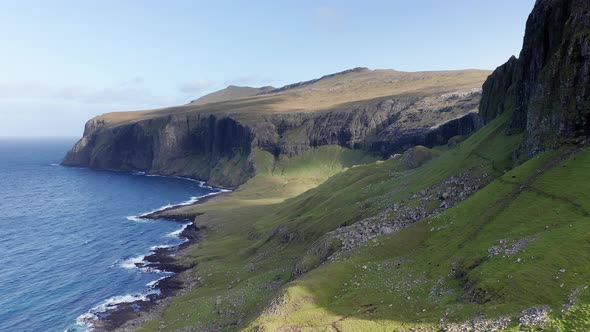 Aerial Back View of Huge Cliffs in Faroe Islands Green Rocky Mountainpowerful Ocean Wavesin a Cloudy alt