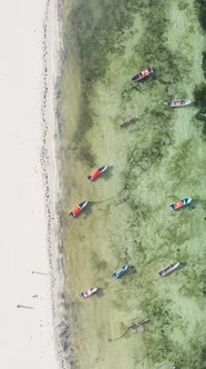 Vertical Video Boats in the Ocean Near the Coast of Zanzibar Tanzania alt