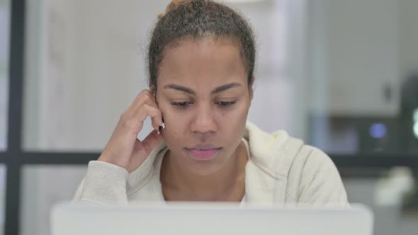 Close Up of African Woman Taking Nap While Using Laptop alt