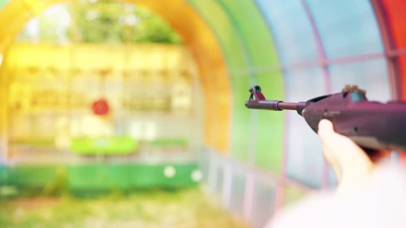 Close-up: Young Guy, Performs a Shot in Shooting Dash From a Pneumatic Gun alt