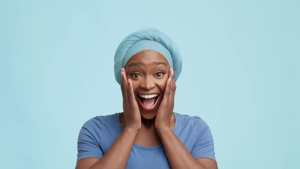 Joyful African American Female Expressing Excitement Nodding Head Yellow Background alt