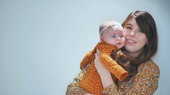 A Loving Mother with Her Child Against a Sulfur Background alt