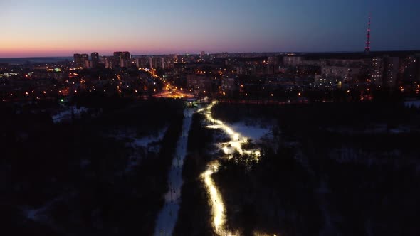 Aerial evening lights Sarzhyn Yar illuminated road