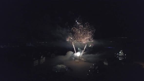 Aerial View At Night Fireworks in Honor of the Holiday Different Colors of Explosions Bright and