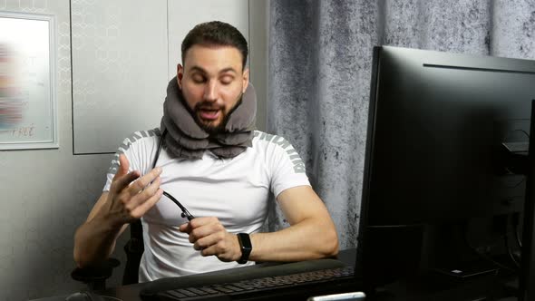 Young Bearded Business Coach Gives an Online Lesson About Medical Orthopedic Collar Neck Brace for alt