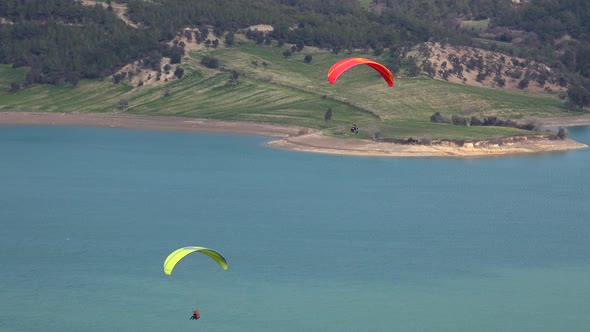 Paragliding Flying Over the Lake alt