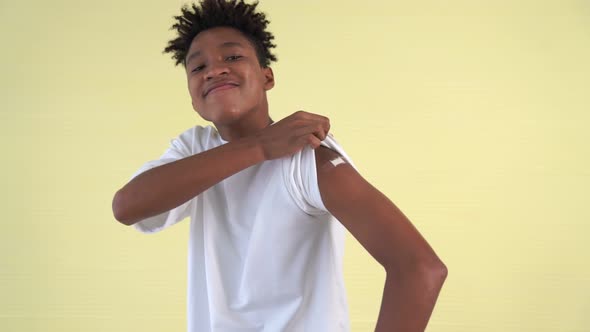 African American Teenager Showing COVID19 Vaccine Bandage Merrily alt