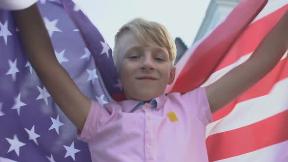 Happy Boy Holding American Flag Celebrating Independence Day, National Pride