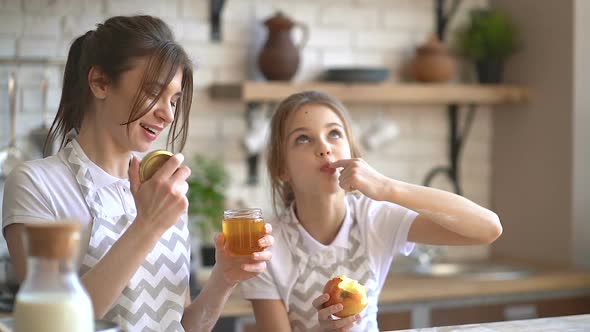 Mother and Little Pretty Daughter Cooking Together