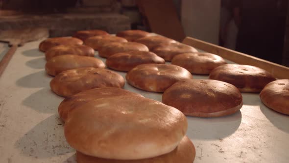 Bread making in a stone oven. alt