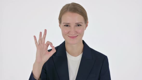 Young Businesswoman Showing Okay Sign on White Background alt