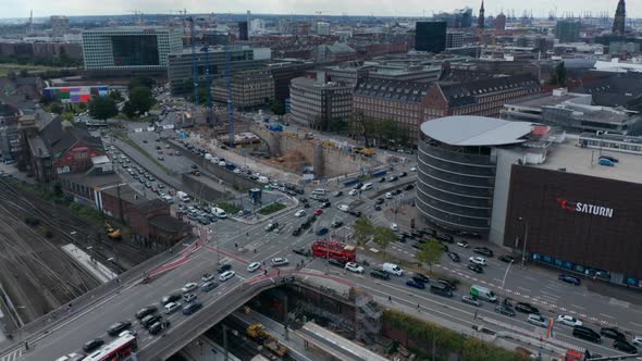 Aerial View of Cars Driving Through Multilane Road Intersection in City During Rush Hour alt