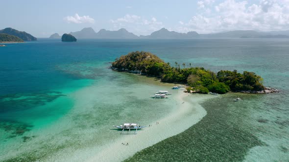 Circling Aerial Footage Around Snake Island Sandbar and Lagoon with Turquoise Azure Shallow Water