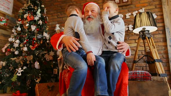 In Santa's Knees Sit Twin Brothers and Tell Fun Story