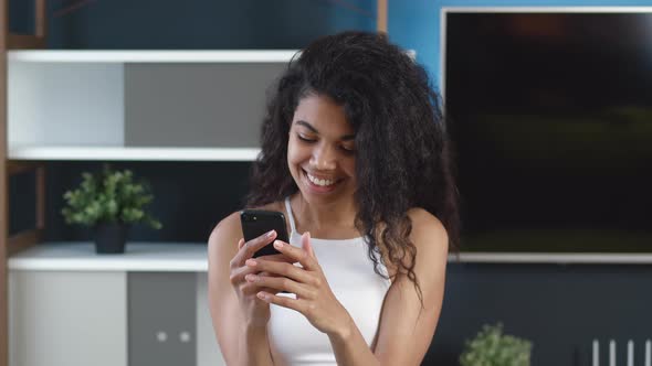 Portrait Beautiful Young African American Woman Using Smartphone Browsing Online Messages Smiling alt