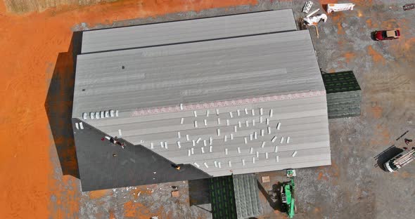 A Asphalt Shingles Installation on the Roof Roofer is Nailing Asphalt Shingles to Roofing alt