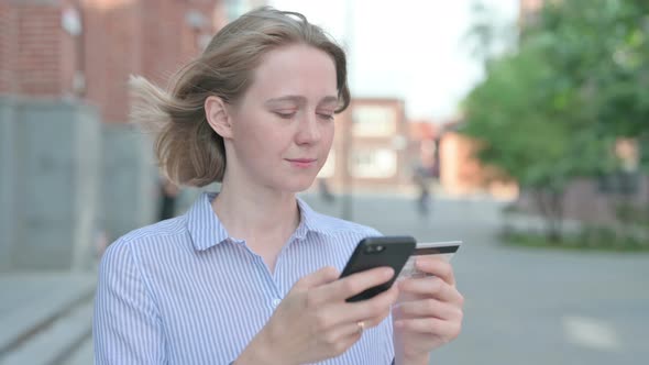 Portrait of Woman Having Online Payment Success on Smartphone alt