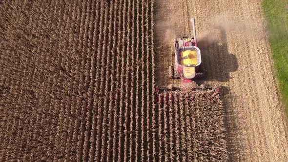 Harvesting Corn With Combine Harvester In Southeast Michigan - aerial drone shot alt