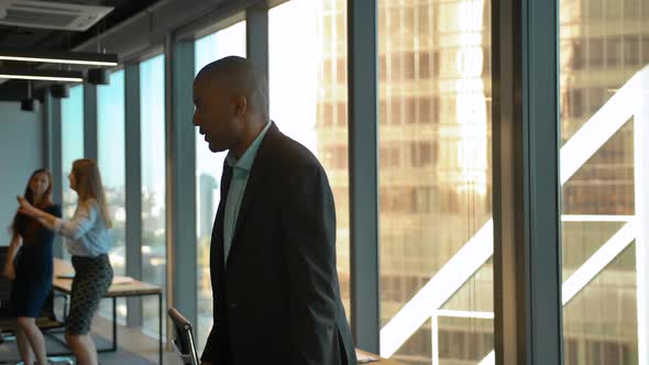 Aframerican and Caucasian Entrepreneurs Dancing at Coworking Office alt