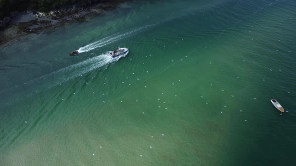 Birds Flying Over Leisure Fishing Boat On River Camel, Padstow, Cornwall Aerial