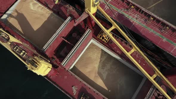 Zoom Out From Bulk Carrier Freight Storage Filled with Soybean or Wheat Transported During Export or alt