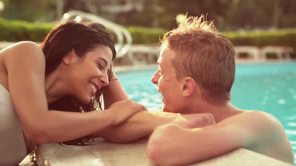 Beautiful Young Romantic Couple Have Fun at the Poolside in Summer Day
