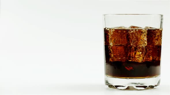 Black Soda With Whiskey And A Lot Of Ice On A White Background