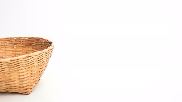 Stop motion animation colorful easter egg in a basket isolated on white background. 