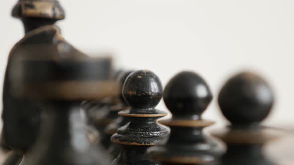 Black player wooden chessmans on  chequered fields 4K 2160p 30fps UltraHD  footage - Row of chess se alt