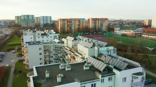 Drone Shot on Modern Multiapartment Buildings with Solar Panels on the Roofs alt