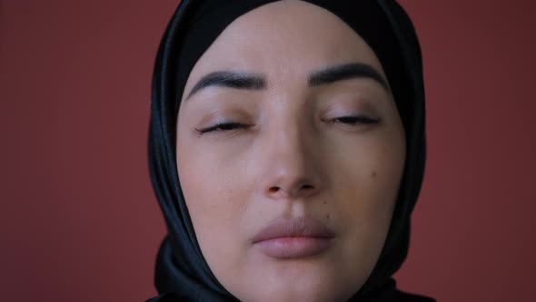 Young Serious and Upset Muslim Woman in Hijab Having Problem and Stress