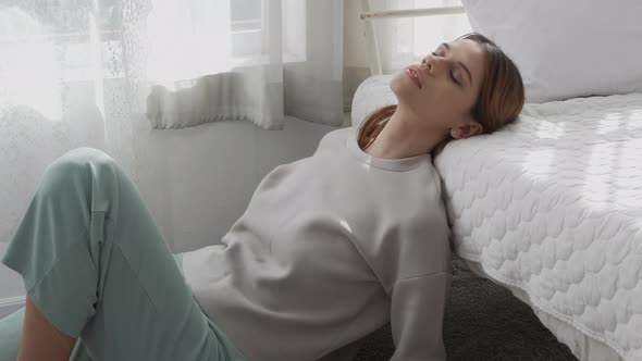 Young caucasian woman is depression and having mental problem in bedroom at home. alt