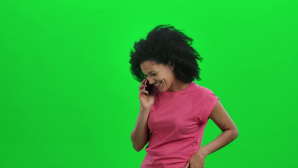 Portrait of Young Female African American Talking for Mobile Phone and Rejoice alt