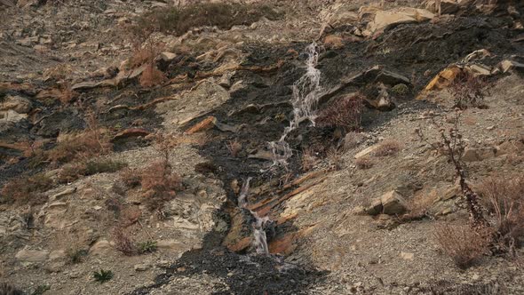 Spring Water Flows Down the Cliff