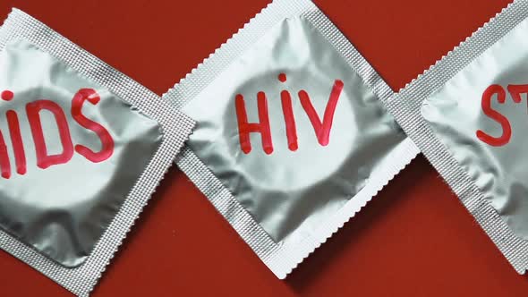 Stop AIDS HIV Words Written on Condoms, Control of