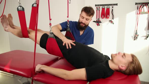 Therapist Doing Healing Treatment Male Leg alt