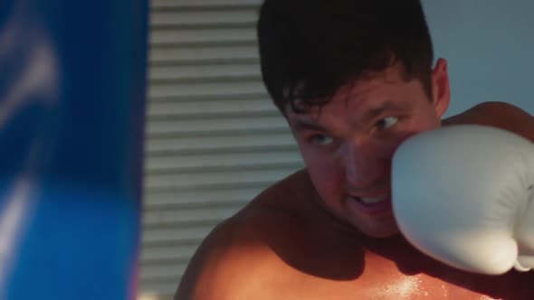 Handsome Sports Man Naked Torso Kicks Punching Bag Cruise Ship Crew Area Boxing Workout in White
