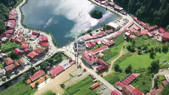 aerial drone circling over a mosque in a small village around the mountains of Uzungol Trabzon on a alt