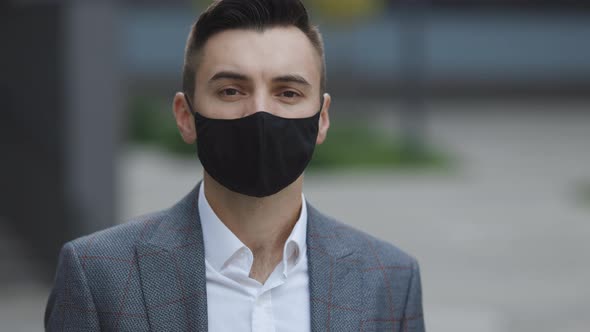 Portrait of an Caucasian Man Wearing a Face Mask Against Air Pollution and Covid19 Coronavirus