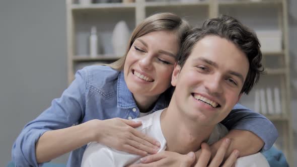 Smiling Romantic Young Couple in Love Looking at Camera alt