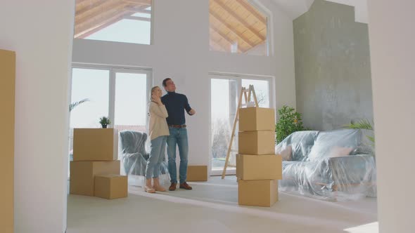 Young couple entering in their new flat alt