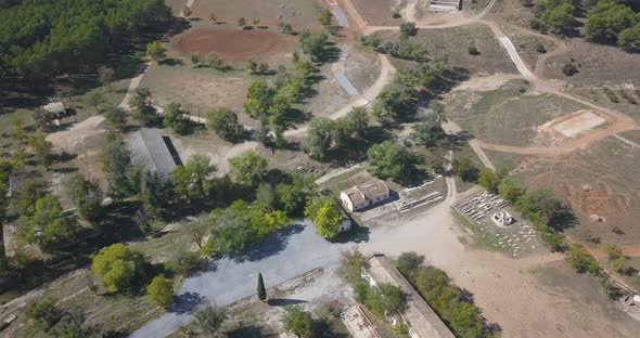 Aerial view of old army facilities with barracks and a firing range abandoned. alt