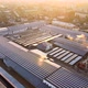 Aerial View of Blue Photovoltaic Solar Panels Mounted on Industrial Building Roof for Producing - VideoHive Item for Sale