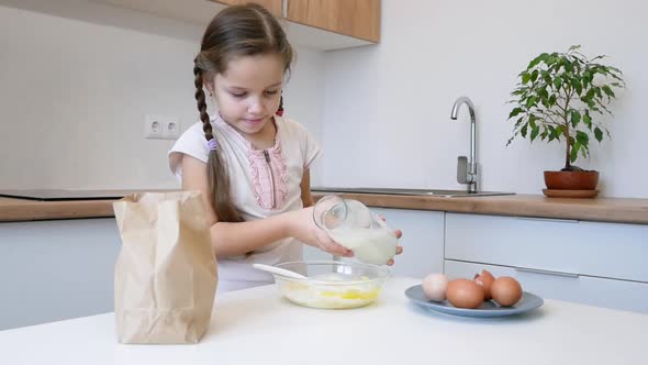 Little Girl Learns to Cook in the Kitchen and Make Bakery alt